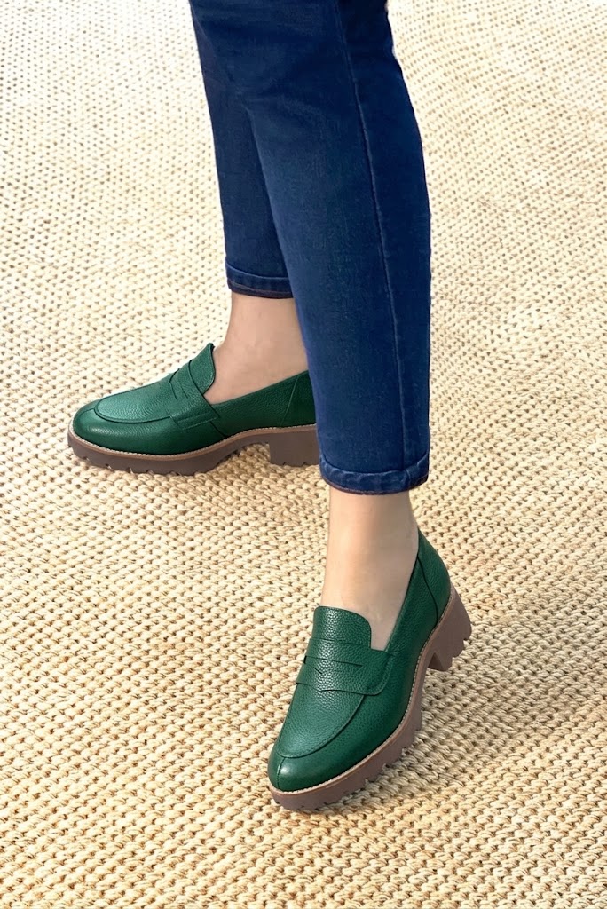 Women's forest green lug-sole loafers with round toe and chunky rubber lug sole - Worn view